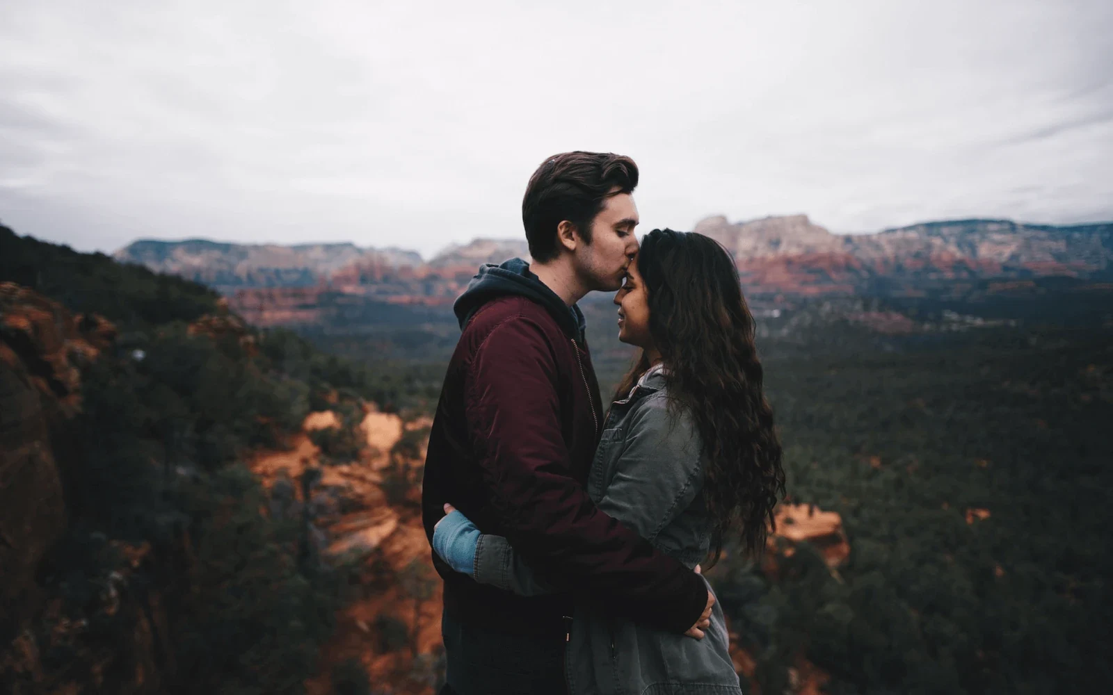 A couple embracing outdoors at golden hour