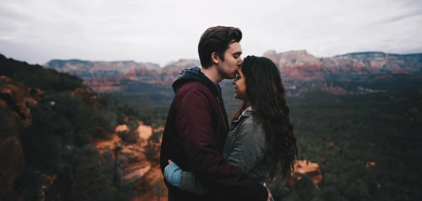 A couple embracing outdoors at golden hour