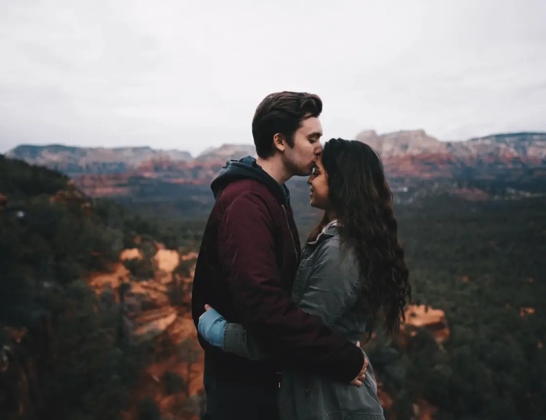 A couple embracing outdoors at golden hour